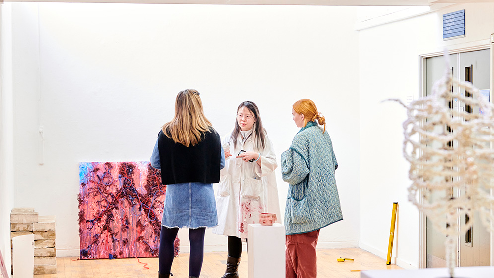 Students in an exhibition space